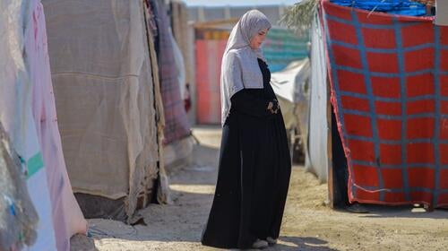 A pregnant displaced woman lives in a tent inside the Deir al-Balah camps. UNFPA Palestine